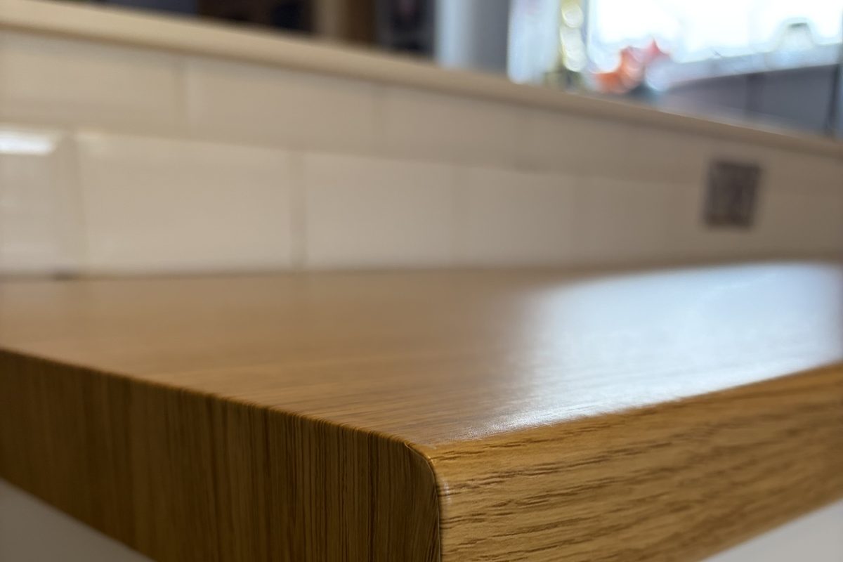 Close-up of a wrapped worktop edge finished to a high installation standard