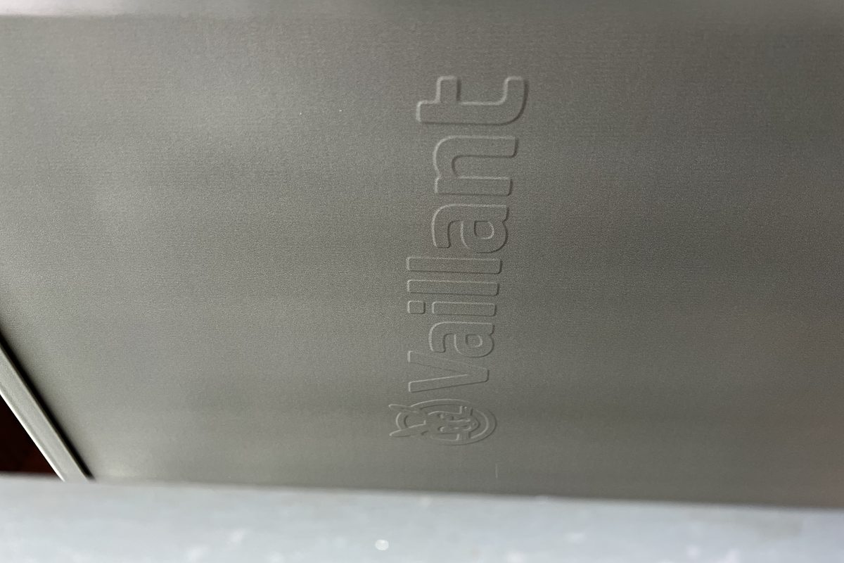 Air source heat pump wrapped in RAL oxide red architectural film, Cambridge