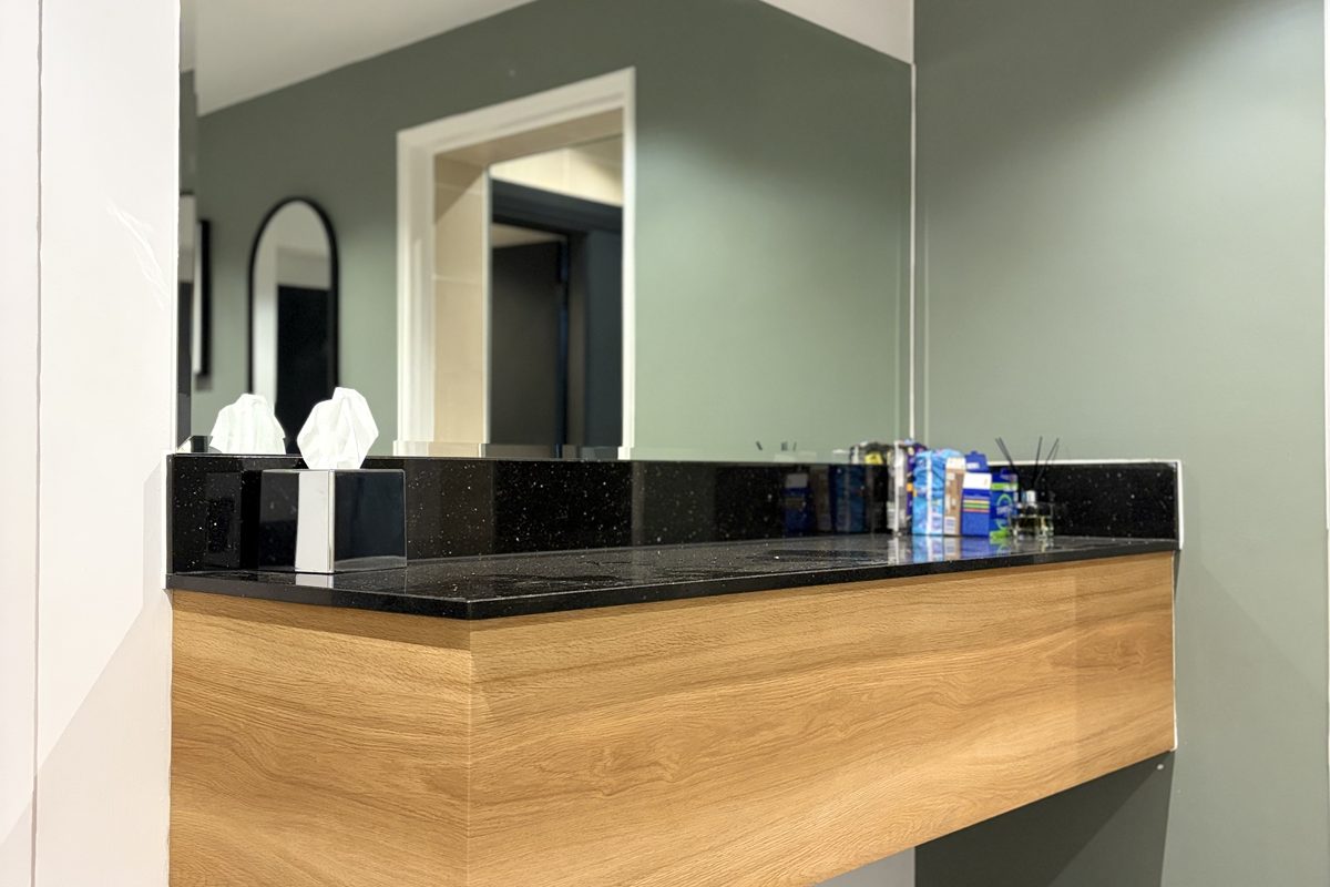 Hotel vanity sink unit wrapped in a waterproof architectural film specification