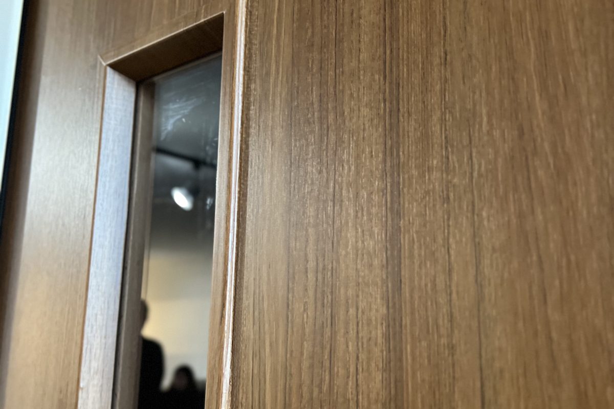 Close-up of a fire-rated film specification on a commercial fire door