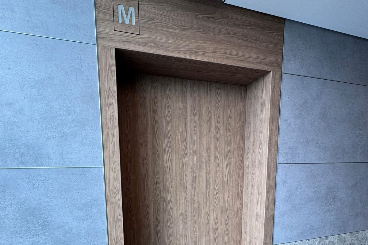 Lift interior wrapped in architectural film, completed for a commercial client