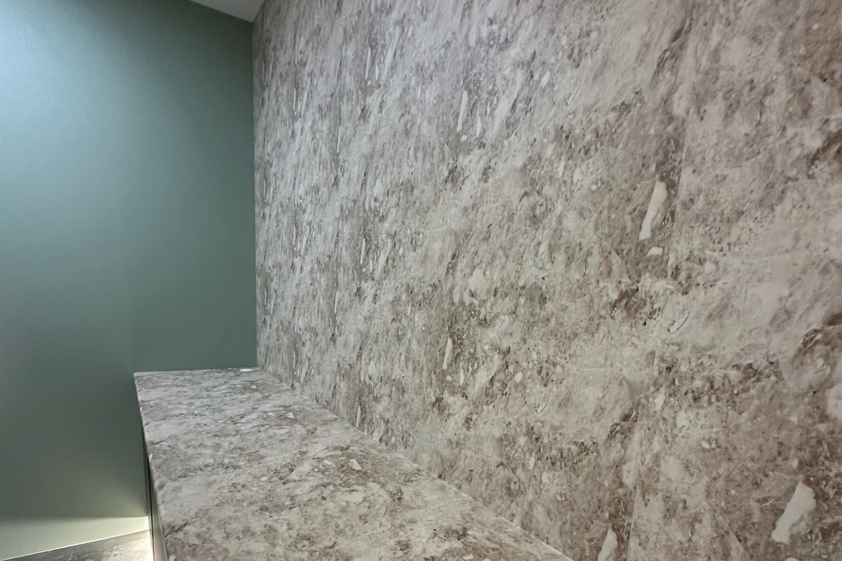 Commercial feature wall refreshed using architectural film with the existing structure retained
